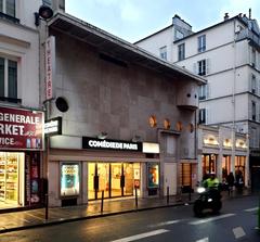 Comédie de Paris theatre facade at night with illuminated signage