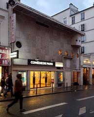 Exterior view of Comédie de Paris theater with blue sky