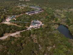 Aerial view of Concordia University Texas campus with modern and historic buildings surrounded by greenery