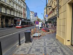 View of Národní třída street with historical buildings and people