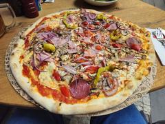 L'Osteria restaurant in Prague with outdoor seating and people dining