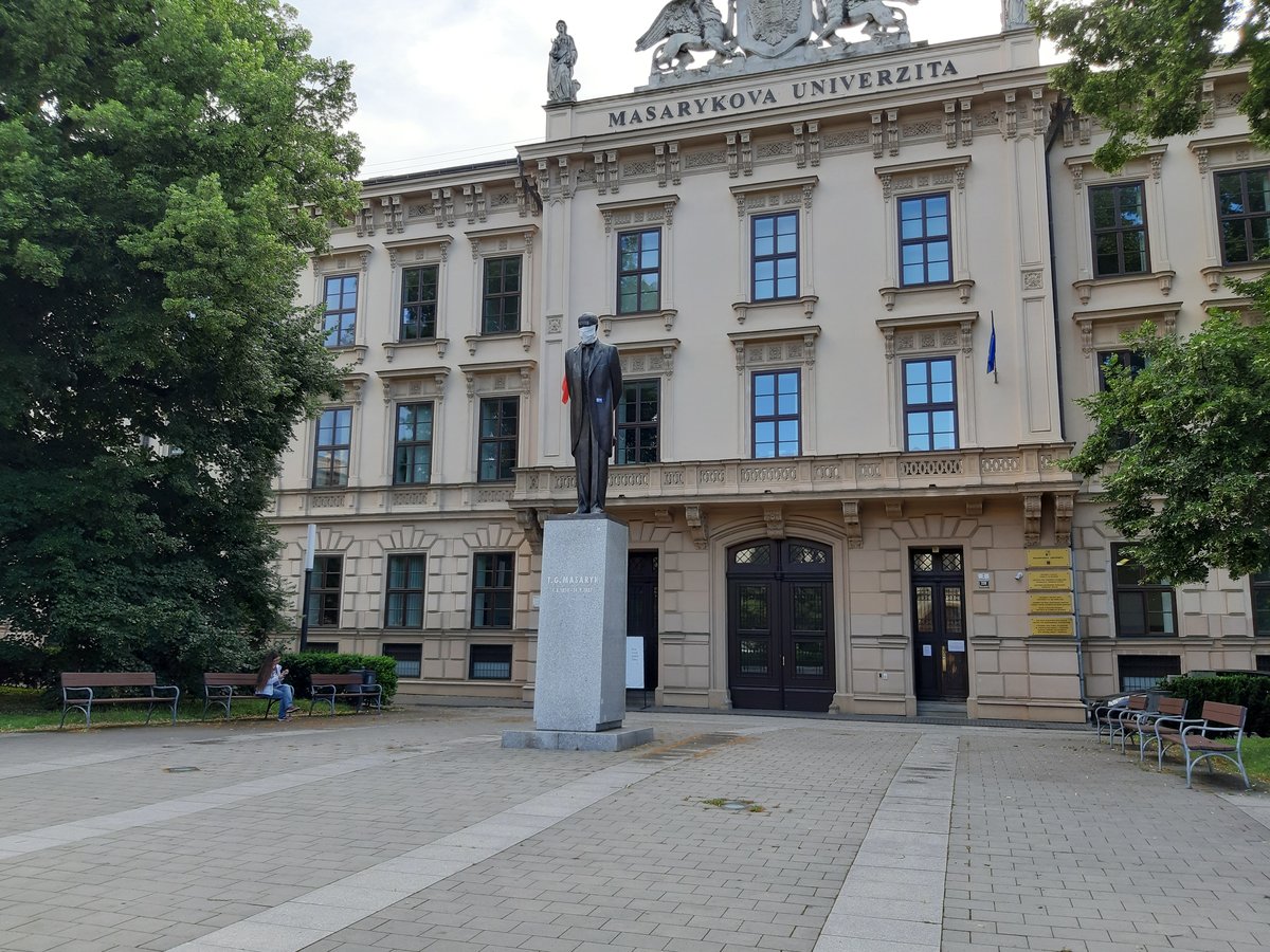 Statue of Tomáš Garrigue Masaryk with a face mask in front of Masaryk University during COVID-19 pandemic