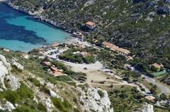 Aerial view of Calanque de Sormiou with turquoise water and rocky cliffs