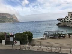 Scenic view of Cassis, France coastline with colorful buildings and clear blue sea
