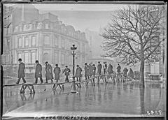 Flooded Avenue Montaigne in Paris with people walking on wooden planks on stilts during the January 31, 1910 flood