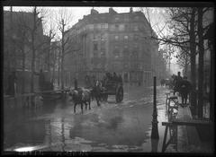 Flooding in Place Saint-Charles, 15th arrondissement, Paris, January 31, 1910, with horse-drawn carts on raised planks