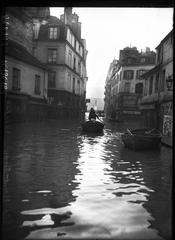 Boats navigating flooded Rue du Haut-Pavé during the January 1910 floods in Paris 5th arrondissement