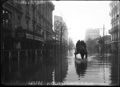 1910 Paris flood on Rue de la Convention, 15th arrondissement, horse-drawn vehicle and pedestrians on planks over water