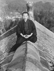 Ogawa Seiyo sitting on the roof of the Daibutsuden hall at Todaiji Temple