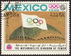 1968 multicolored airmail stamp from the Kingdom of Yemen featuring Olympic flag and Palacio de los Deportes sports venue for the XIXth Summer Olympic Games in Mexico City