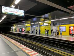 View of De Brouckère metro station in Brussels with escalators and people