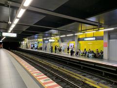View of De Brouckère metro station in Brussels with escalators and commuters