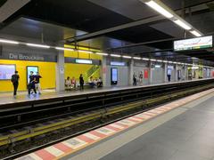 View of De Brouckère metro station in Brussels with escalators and commuters