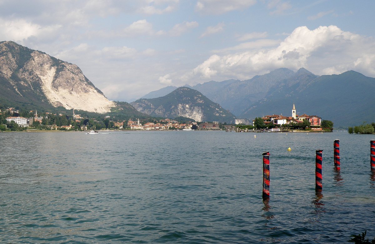 View of Lake Maggiore from Isola Bella with Isola dei Pescatori island, town of Baveno, and alpine mountains in the background