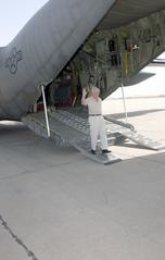 US Senator Richard G. Lugar walking down the ramp of a USAF C-130 Hercules aircraft at Baghdad International Airport