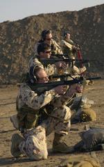 Australian and American military personnel firing F88 5.56 mm Weapon Systems at Baghdad International Airport firing range during Operation IRAQI FREEDOM