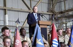 U.S. Secretary of Defense Donald H. Rumsfeld addressing U.S. Army soldiers inside a hangar at Baghdad International Airport Iraq