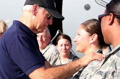 Vice President Joe Biden talking with servicemembers on the flightline at Baghdad International Airport in 2010
