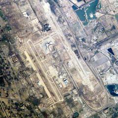 Aerial view of Baghdad International Airport showing runways, taxiways, and terminal buildings
