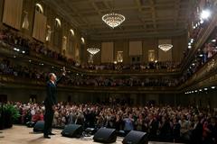 President Barack Obama waving to audience at Symphony Hall Boston 2012