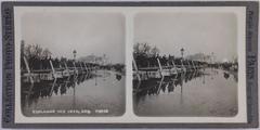Stereoscopic view of Esplanade des Invalides in Paris with people on a wooden footbridge, water on the right, and background view of Alexandre III bridge pillars and Grand Palais