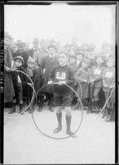 Children playing hoop game competition at Esplanade des Invalides in Paris 1919