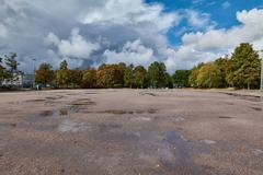 Kaisaniemen puisto park in Helsinki with lush green trees and walking paths on a sunny day