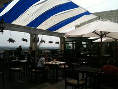 Breeze Sky Bar at Majestic Hotel Saigon with city skyline at sunset