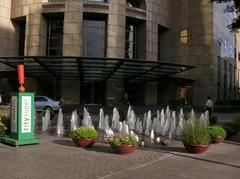 Far Eastern Plaza North Fountain with water jets and cityscape background