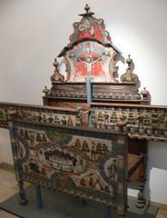 Painted softwood Aufsatzbett by Urban Huemer dating 1781 with wedding feast scene, Gnadenstuhl and Madonna with Child