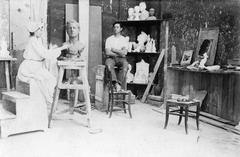 Sculptor Lola Mora working in her studio with a model