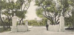 Entrance to Fort Dallas Park with historical buildings and greenery in Miami, Florida