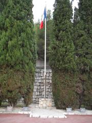 Cross of Lorraine and flag of the Fusillés de l'Ariane square in Nice