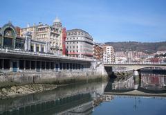 Scenic view of Ría de Bilbao river with city and mountains in the background