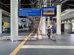 Kuala Lumpur KTM Train Station Concourse interior with red structural elements