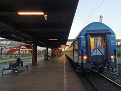 Budapest Kőbánya-Kispest train station platform with tracks and overhead power lines