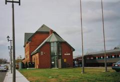 Niagara Falls train station building with glass exterior and surrounding tracks