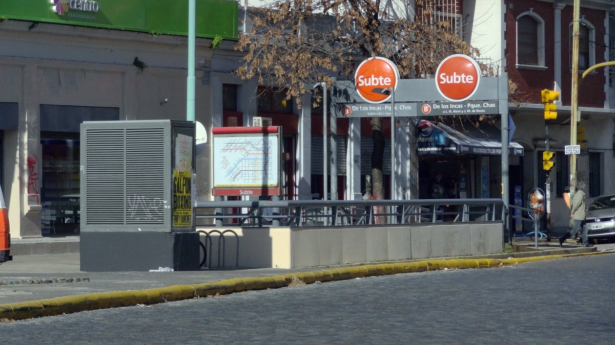Entrance to De Los Incas metro station in Buenos Aires with surrounding urban buildings