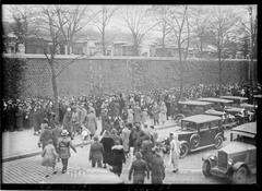 Passersby visiting Père Lachaise Cemetery in Paris during All Saints' Day on November 1, 1932