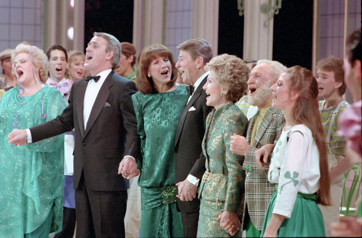 President Ronald Reagan and Nancy Reagan singing at a gala performance with Brian and Mila Mulroney at The Grand Theatre, Quebec