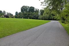 Botanical garden in Oslo with green trees and walking path