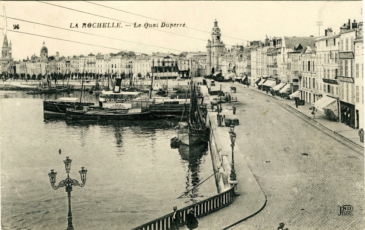 View of Le quai Duperré and La Grosse Horloge clock tower at the port of La Rochelle in the 1920s