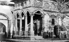 Stavropoleos Inn and Church historic monument entrance with wooden barrels and ornate gate in Bucharest