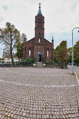 Saint Henry's Cathedral in Helsinki against a bright blue sky