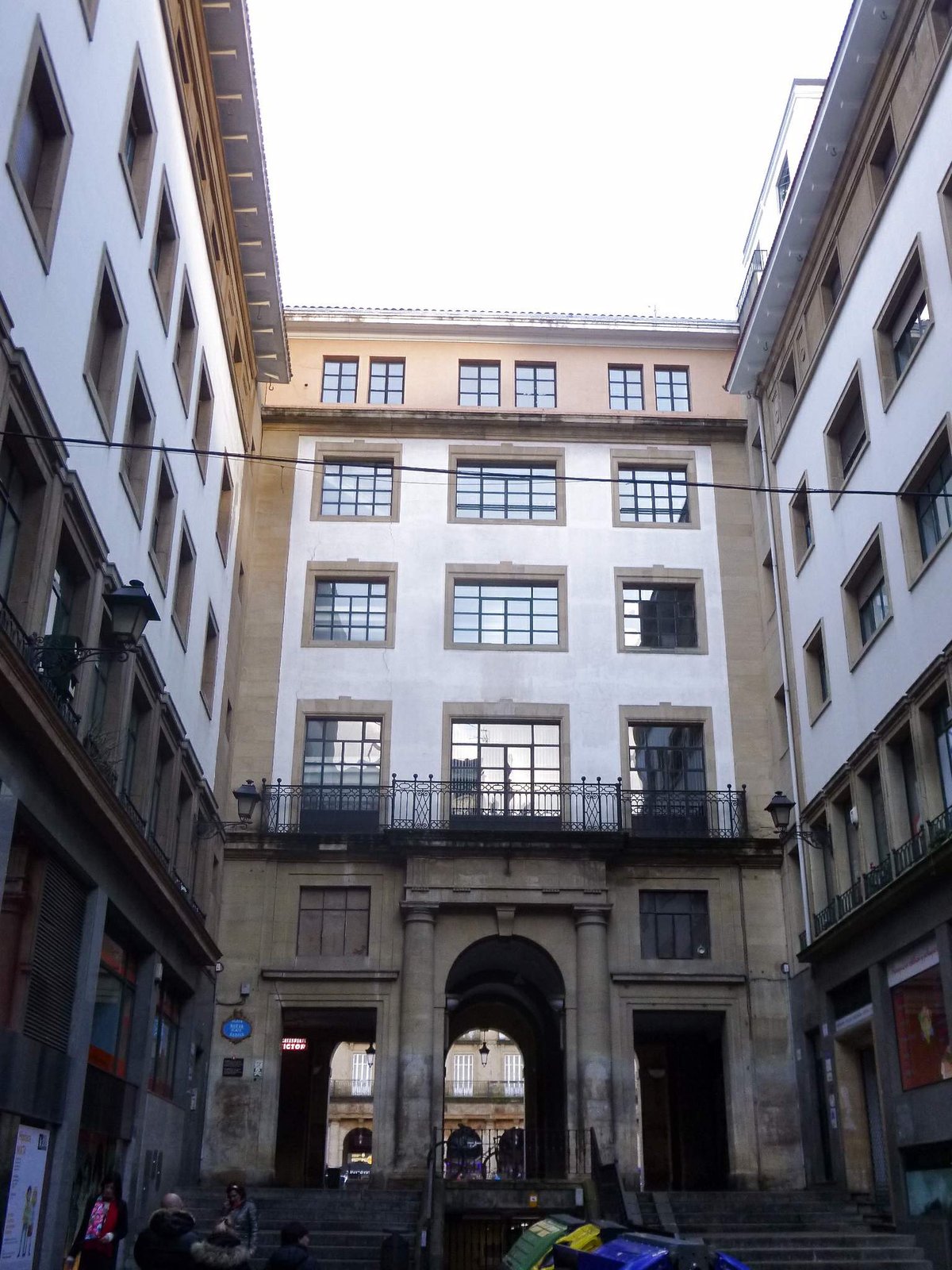 Street view of Calle de Mitxel Labegerie in Bilbao with autumn trees and buildings
