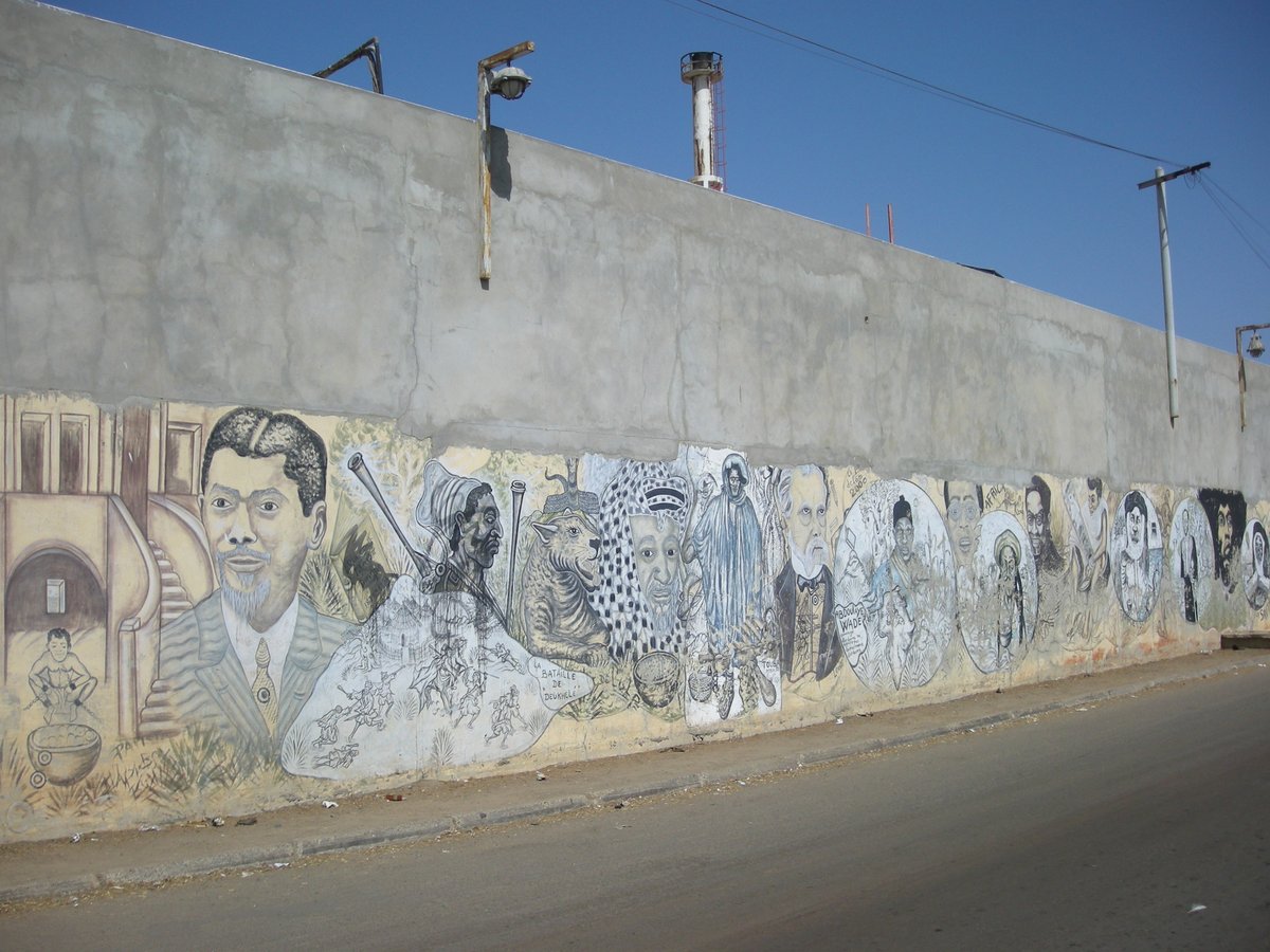 Mural painting on a factory wall in Bel-Air neighborhood, Dakar, Senegal