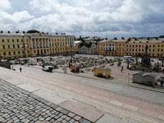 Open-air food court at Helsinki Senate Square with Government Palace in background on July 1, 2020