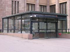 Access to Asematunneli underground shopping center in Helsinki with people walking and modern architecture