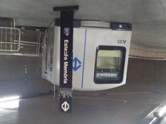 Mezzanine level of Sé metro station with commuters and modern lighting