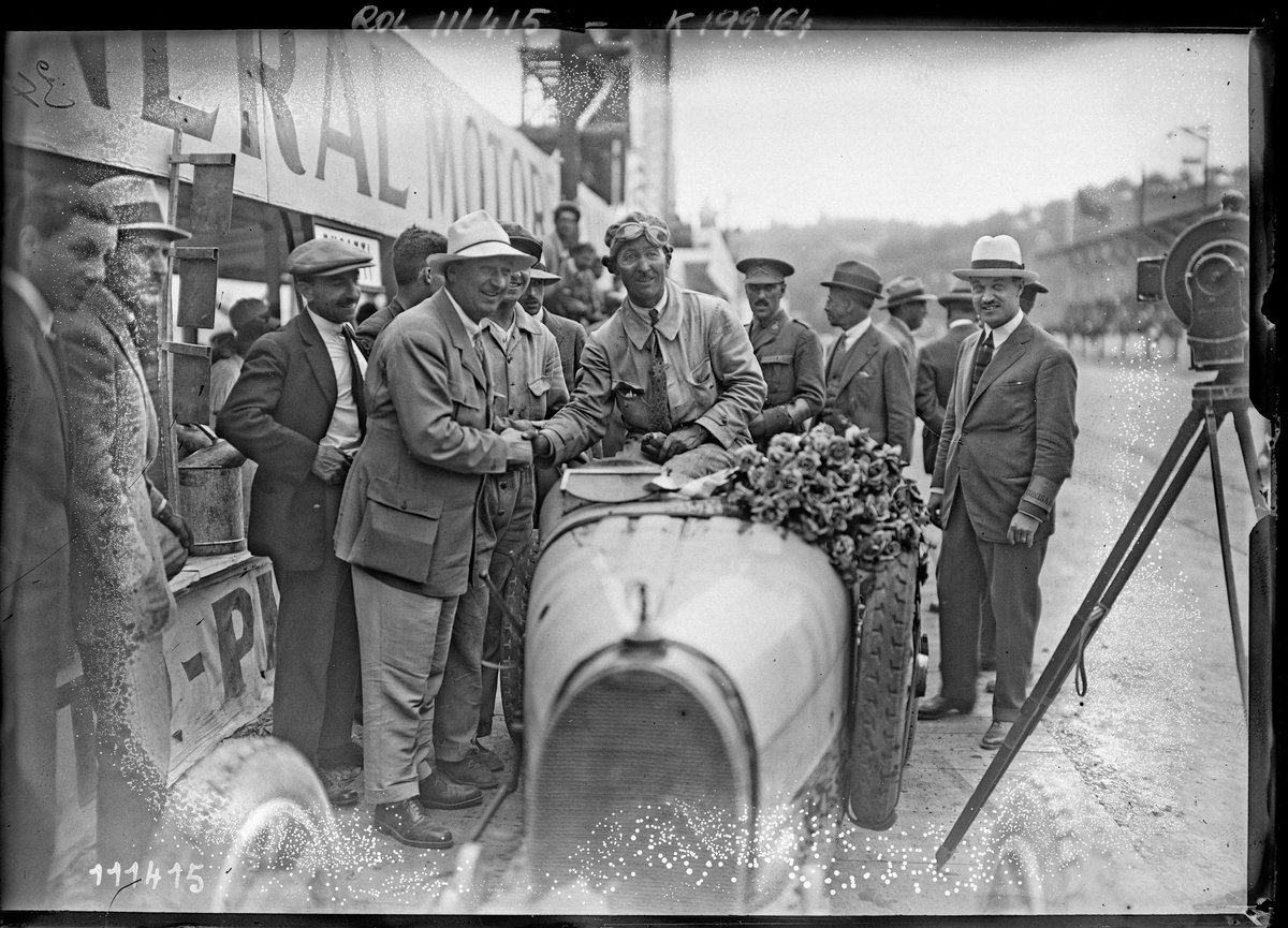 Portrait of Jules Goux with Bugatti automobile after victory at 1926 San Sebastián Grand Prix in Spain
